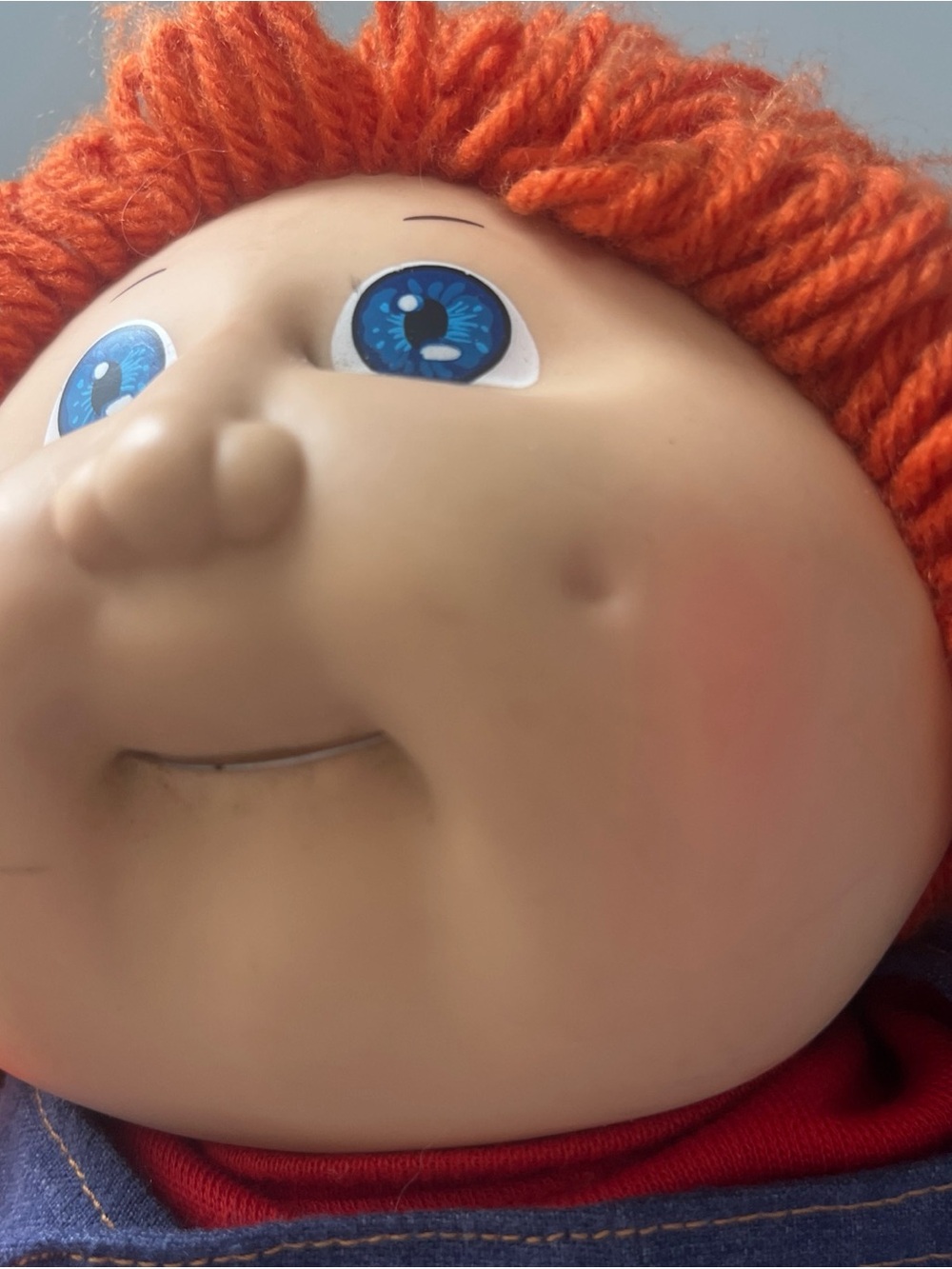 Orange-Haired  Cabbage Patch  Kids Doll with Blue Eyes has tooth retainers